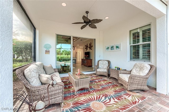 sunroom / solarium with ceiling fan