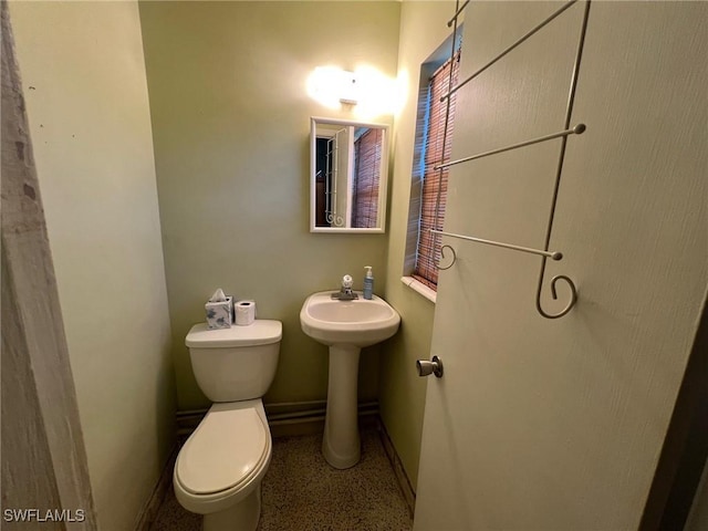 bathroom with toilet and sink