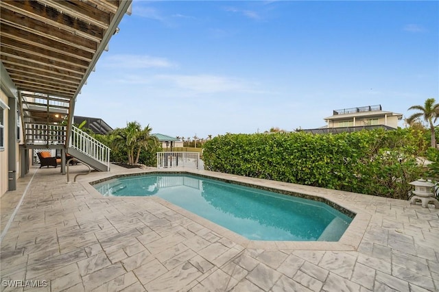 view of swimming pool featuring a patio