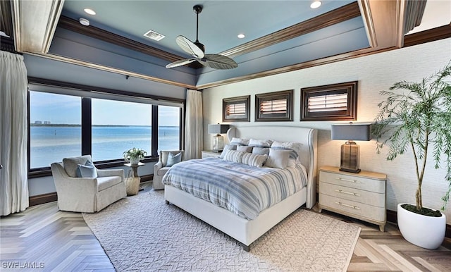 bedroom with light parquet flooring, a water view, ceiling fan, and crown molding