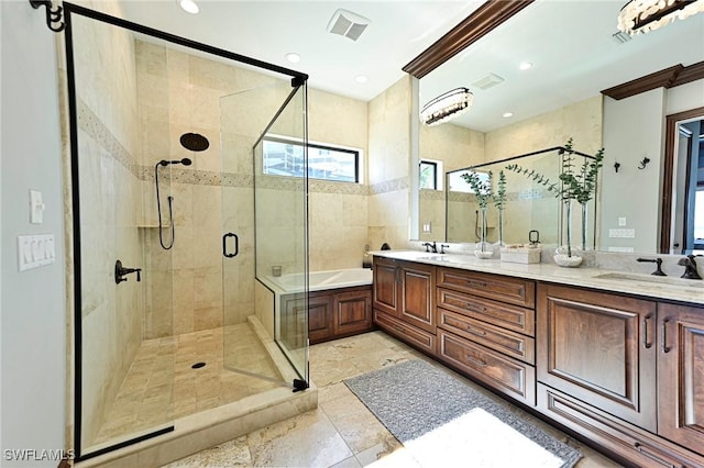 bathroom featuring vanity, crown molding, and independent shower and bath