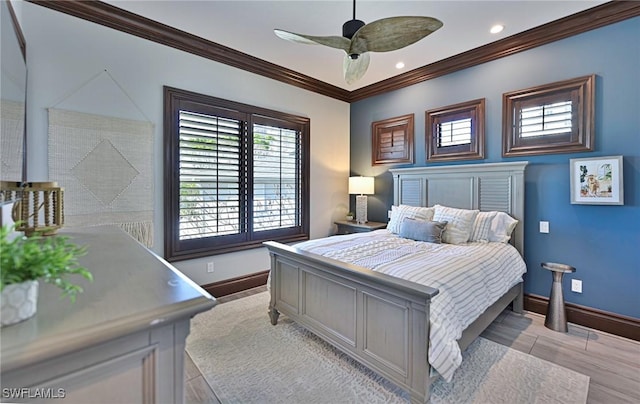 bedroom with ceiling fan and crown molding