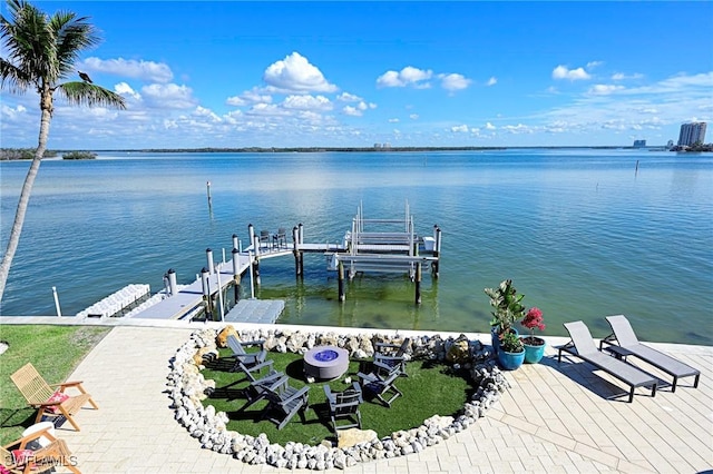 view of dock featuring central AC unit and a water view