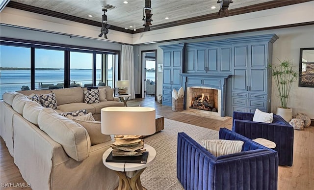 living room with a water view, wood ceiling, crown molding, and light hardwood / wood-style flooring