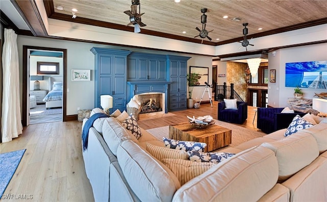 living room featuring light hardwood / wood-style flooring, ceiling fan, crown molding, and wood ceiling