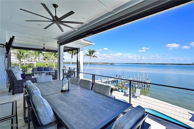 exterior space featuring ceiling fan, a water view, and an outdoor hangout area