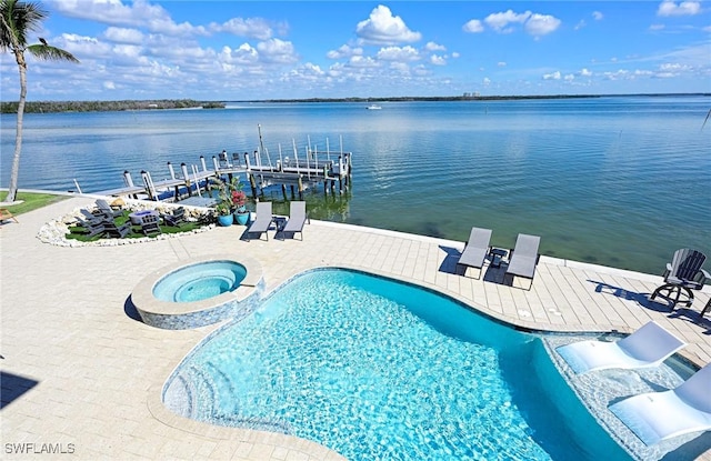 view of pool featuring a boat dock, a patio area, a water view, and an in ground hot tub