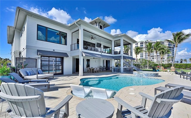 view of swimming pool featuring an in ground hot tub, a patio, and ceiling fan