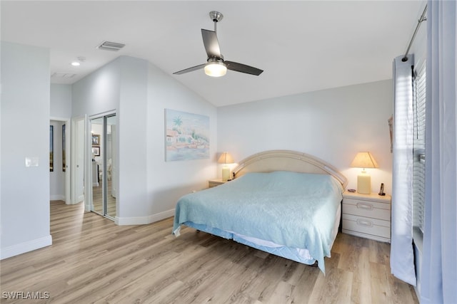 bedroom with light wood-type flooring, vaulted ceiling, and ceiling fan