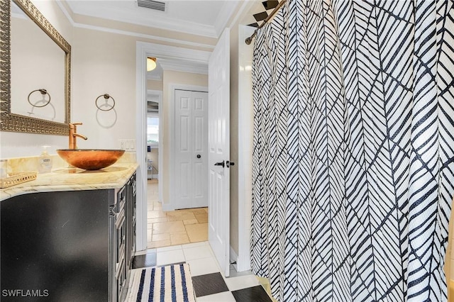 bathroom with vanity, a shower, and ornamental molding