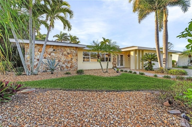 ranch-style home with a front yard