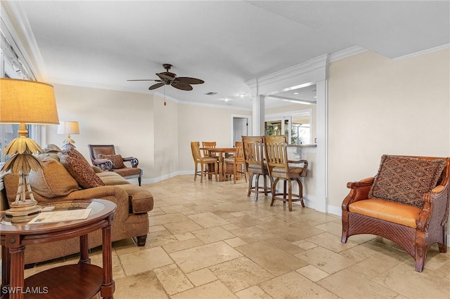 living room with ceiling fan and ornamental molding