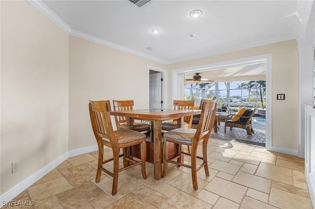 dining room with ceiling fan and ornamental molding