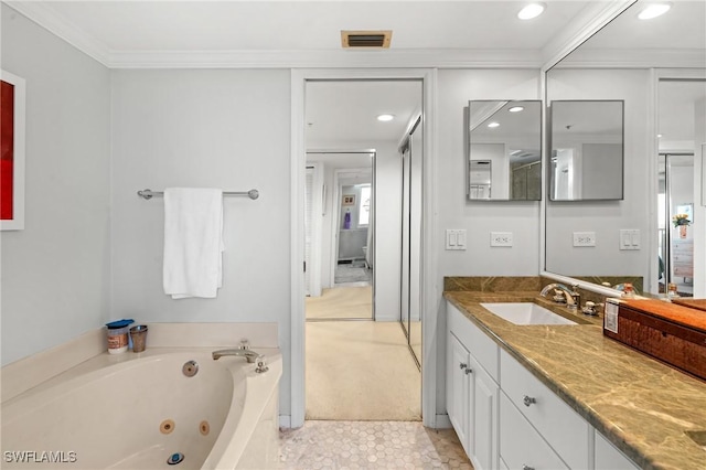 bathroom with recessed lighting, vanity, visible vents, ornamental molding, and a tub with jets