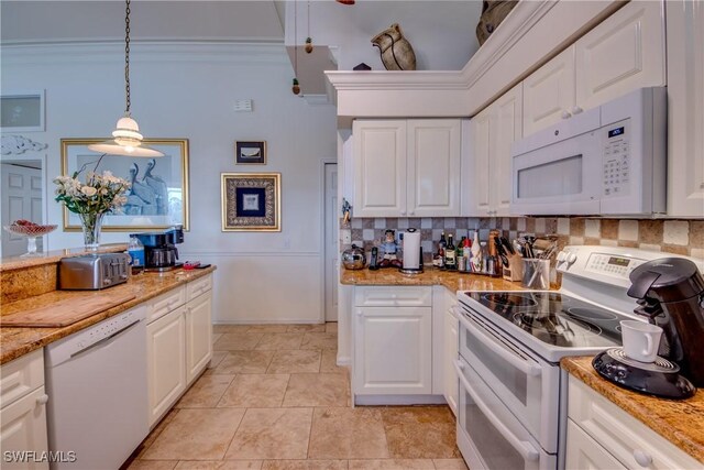 kitchen featuring white cabinets, pendant lighting, light stone countertops, and white appliances