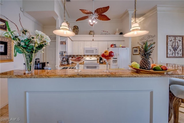 kitchen featuring white cabinetry, pendant lighting, white appliances, and ornamental molding