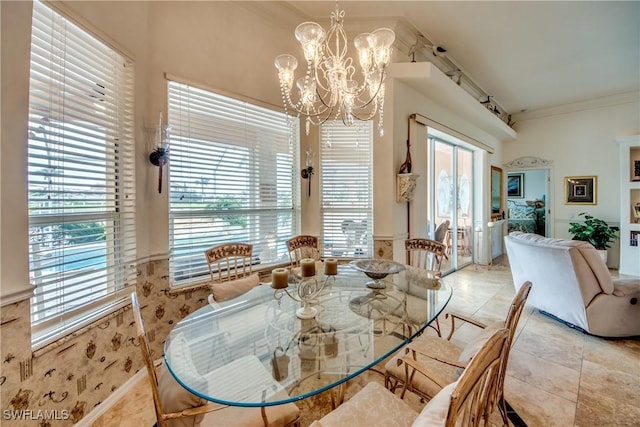 dining space with an inviting chandelier and ornamental molding