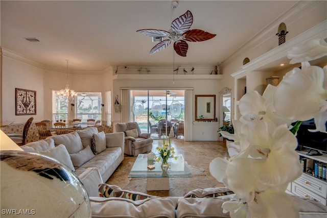 living room featuring ceiling fan with notable chandelier and ornamental molding