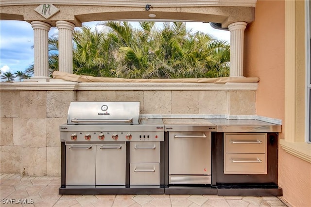 view of patio with a grill