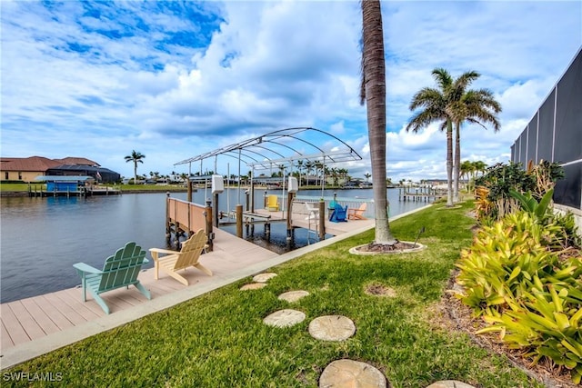 view of dock featuring a water view and a yard