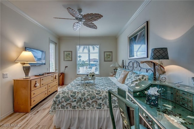 bedroom featuring ceiling fan, crown molding, and light hardwood / wood-style flooring