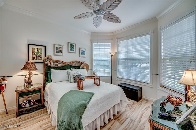 bedroom with ceiling fan and ornamental molding