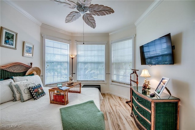 bedroom with crown molding and hardwood / wood-style floors