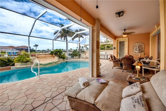 view of pool with a lanai and a patio