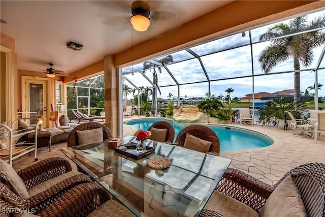 view of patio featuring glass enclosure and an outdoor hangout area