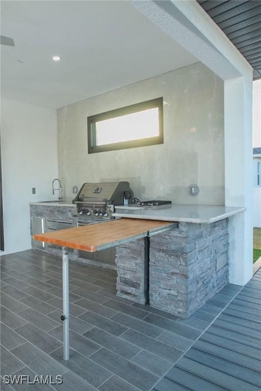 kitchen with butcher block counters and sink