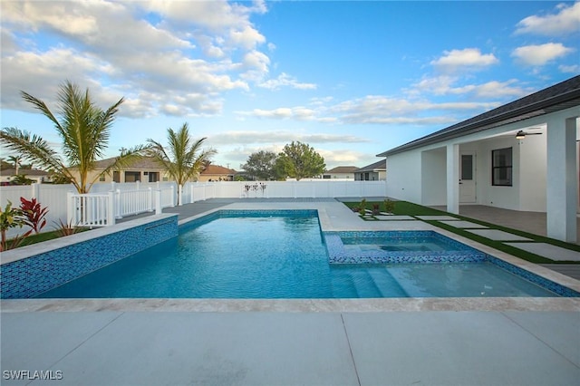 view of pool with ceiling fan, a patio area, and an in ground hot tub