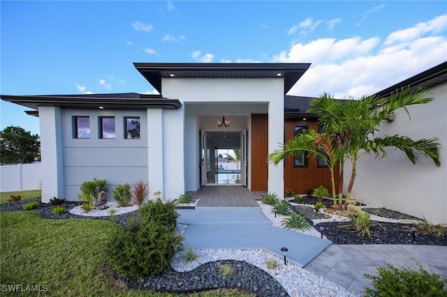 doorway to property with a yard