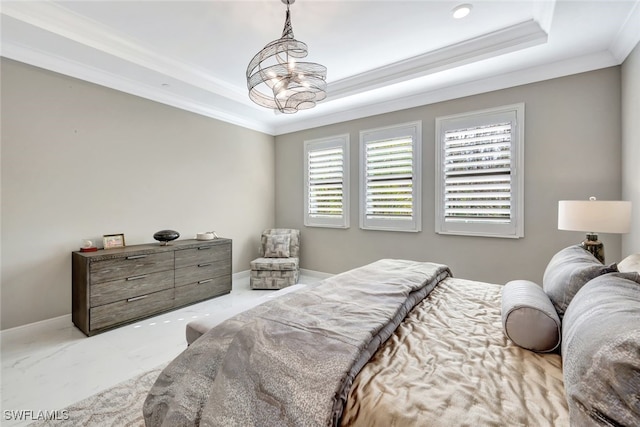 bedroom with an inviting chandelier, crown molding, and a tray ceiling