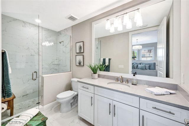 bathroom featuring vanity, an enclosed shower, and toilet