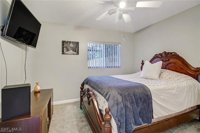 bedroom with ceiling fan and light colored carpet