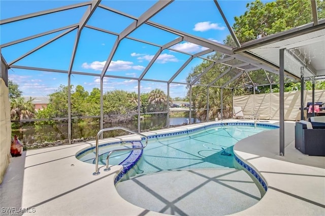 view of pool with a lanai, an in ground hot tub, a water view, and a patio