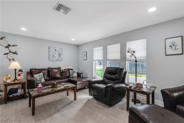 living room featuring recessed lighting, visible vents, and baseboards