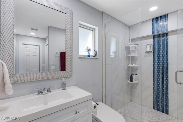 bathroom featuring toilet, recessed lighting, visible vents, vanity, and a stall shower