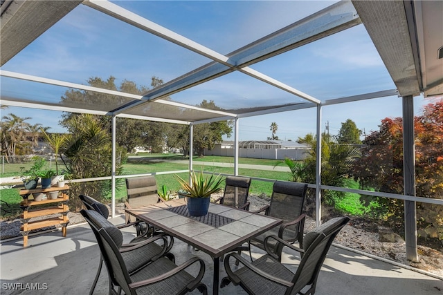 view of patio with outdoor dining space and fence