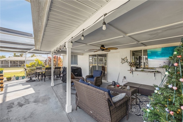 view of patio / terrace featuring outdoor dining area, ceiling fan, and an outdoor hangout area