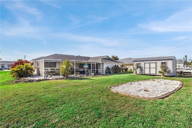 back of property featuring a storage shed, a lawn, and an outbuilding