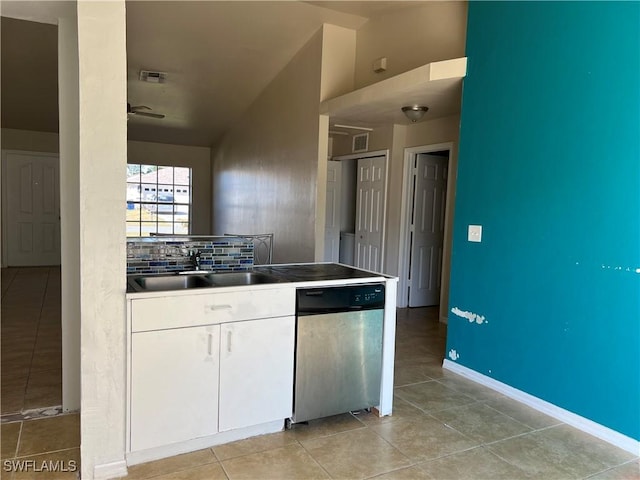 kitchen featuring dishwasher, backsplash, white cabinets, sink, and ceiling fan