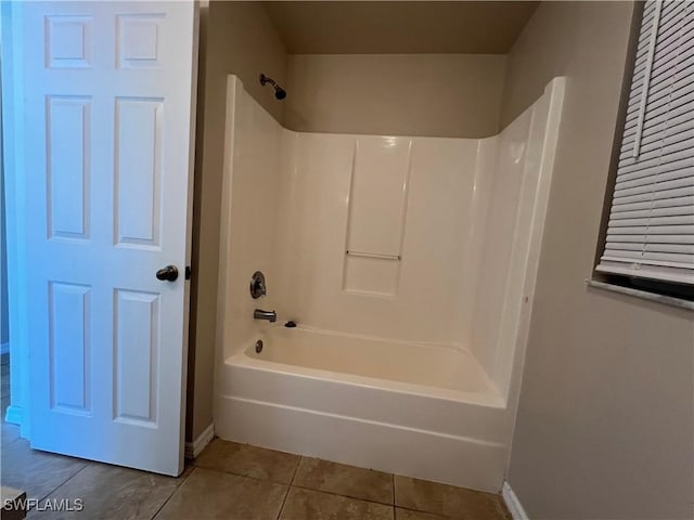 bathroom featuring bathing tub / shower combination and tile patterned flooring