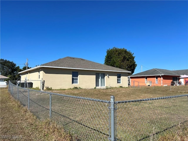 view of side of home with a lawn