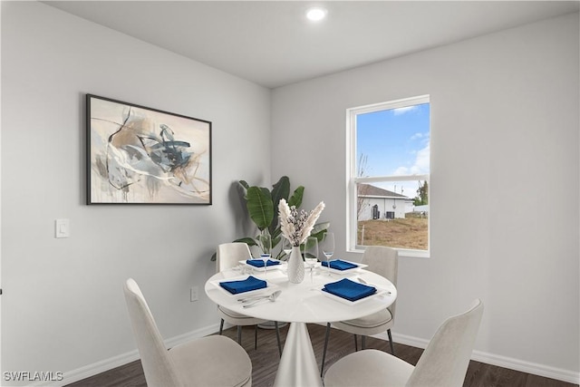 dining area with dark wood-type flooring