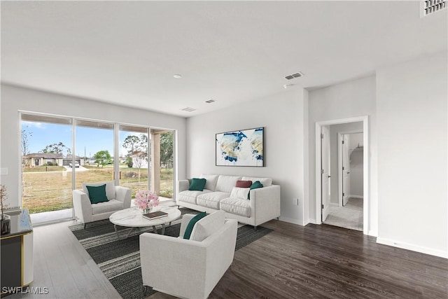 living room with dark hardwood / wood-style floors