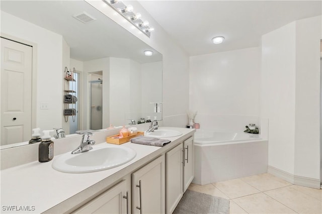 bathroom with tile patterned flooring, vanity, and independent shower and bath