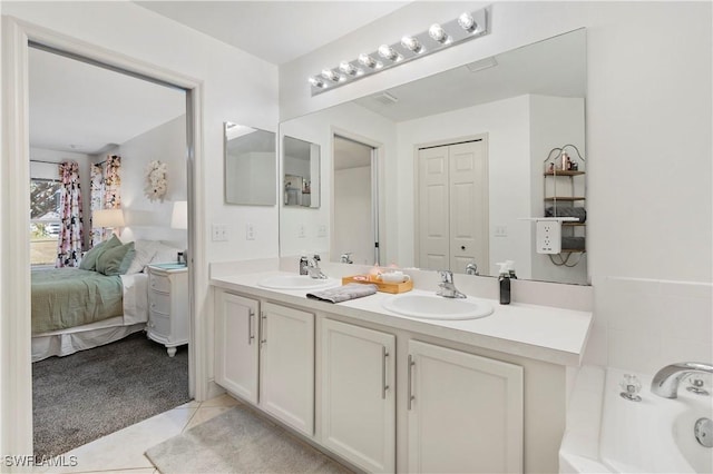 bathroom with tile patterned flooring and vanity