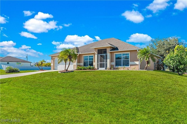 view of front of home featuring a garage and a front lawn