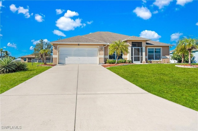 view of front of house featuring a garage and a front lawn